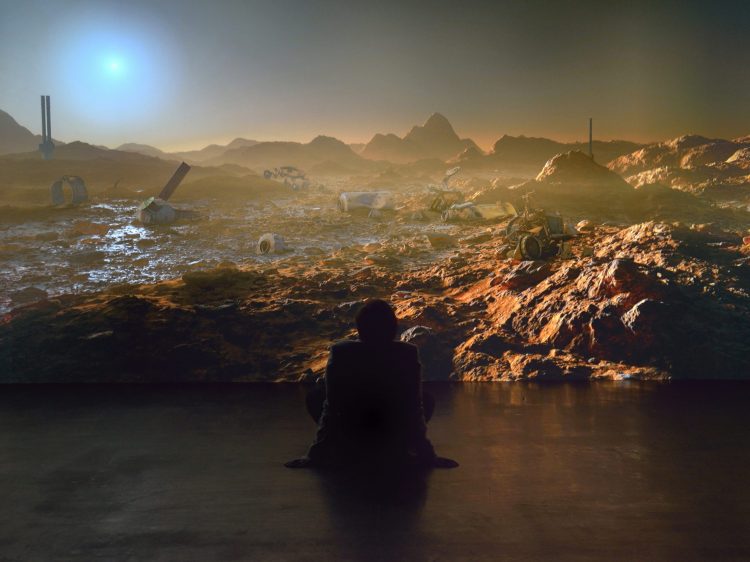 a silhouette sat in front of a martian landscape