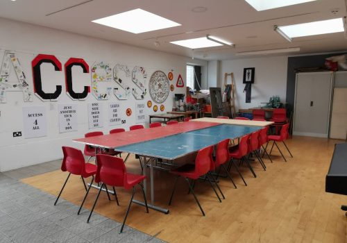 a large table in a creative workshop