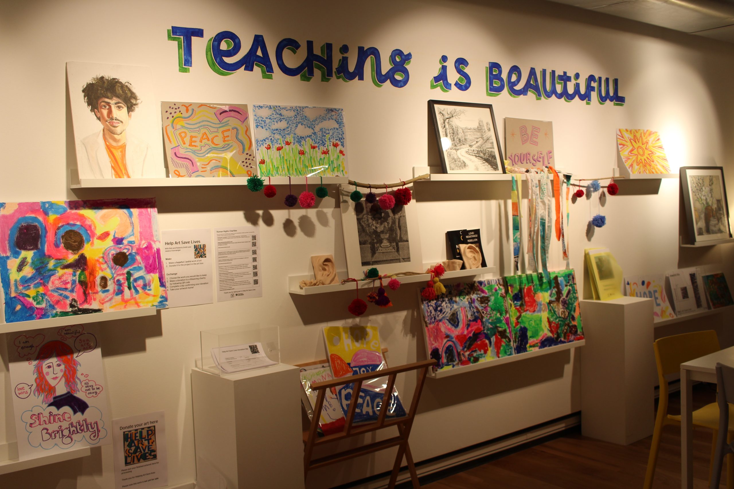 A wall full of art with teaching is beautiful painted on the wall.
