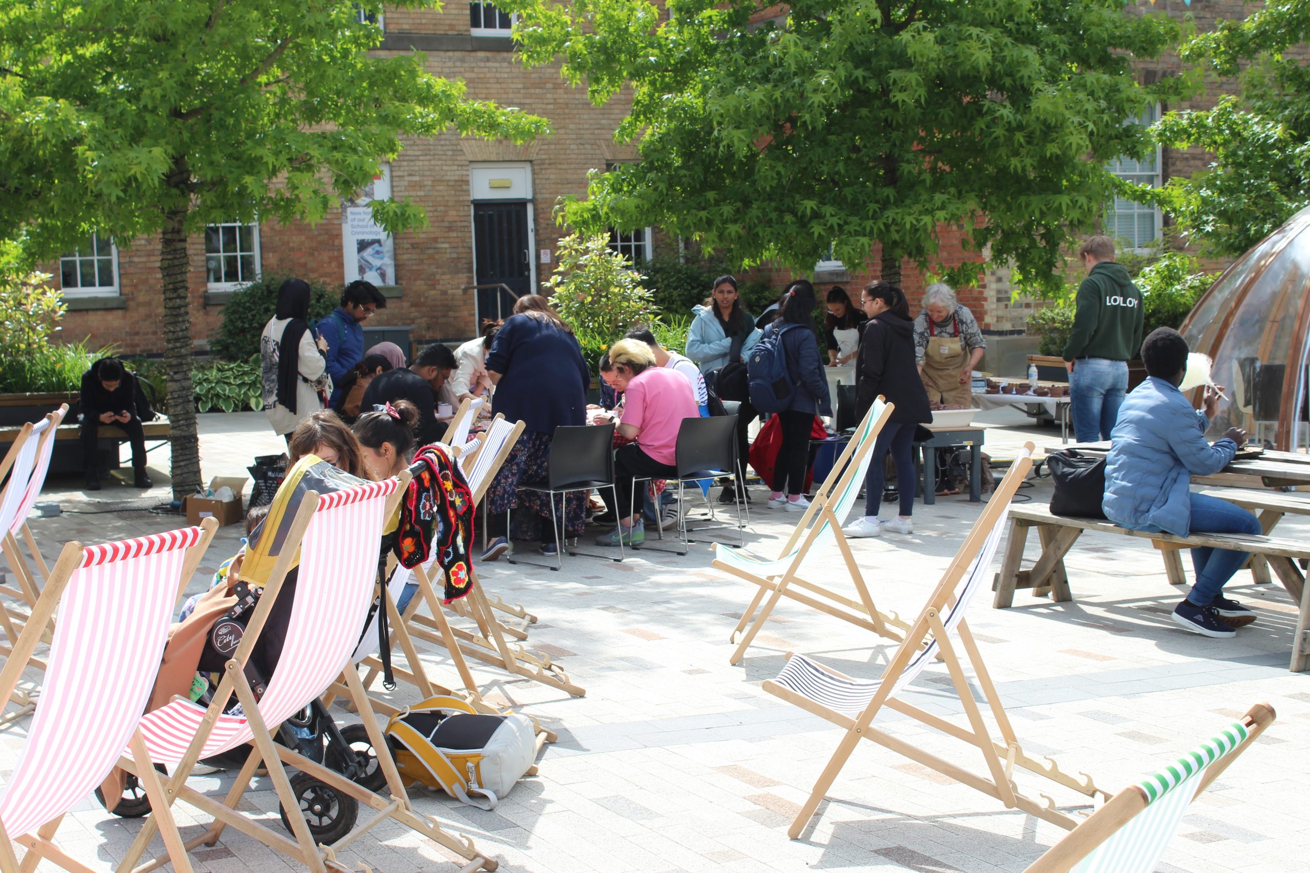 Students relax on deck chairs and take part in the creative crafts.