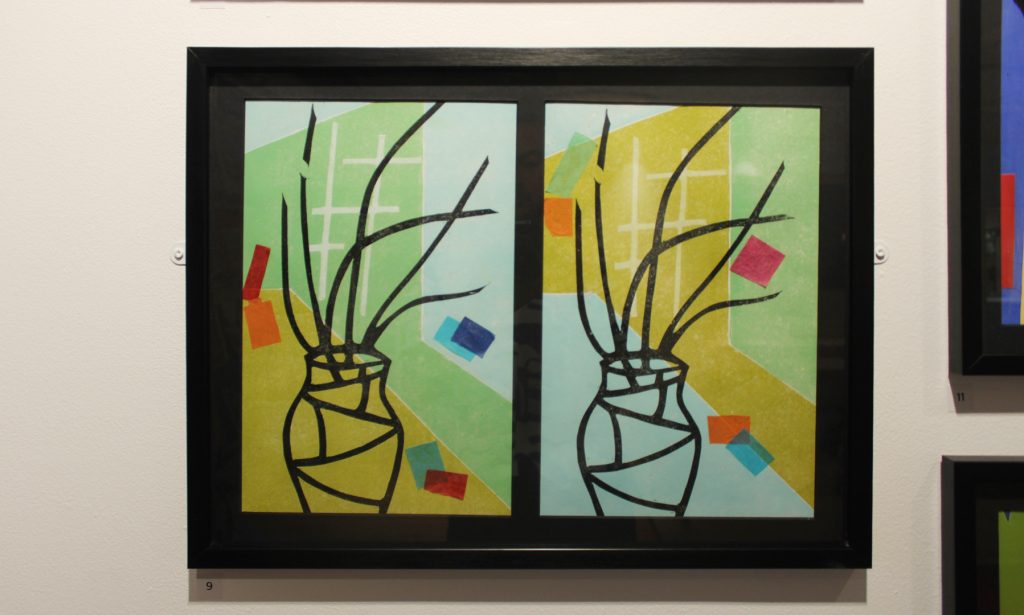 Framed collagist artworks with a plant pot