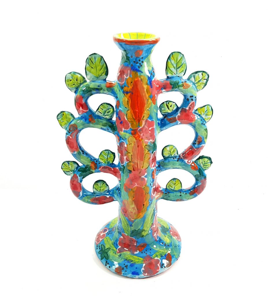 Image of a colourful vase inspired by the tree of life against a white background