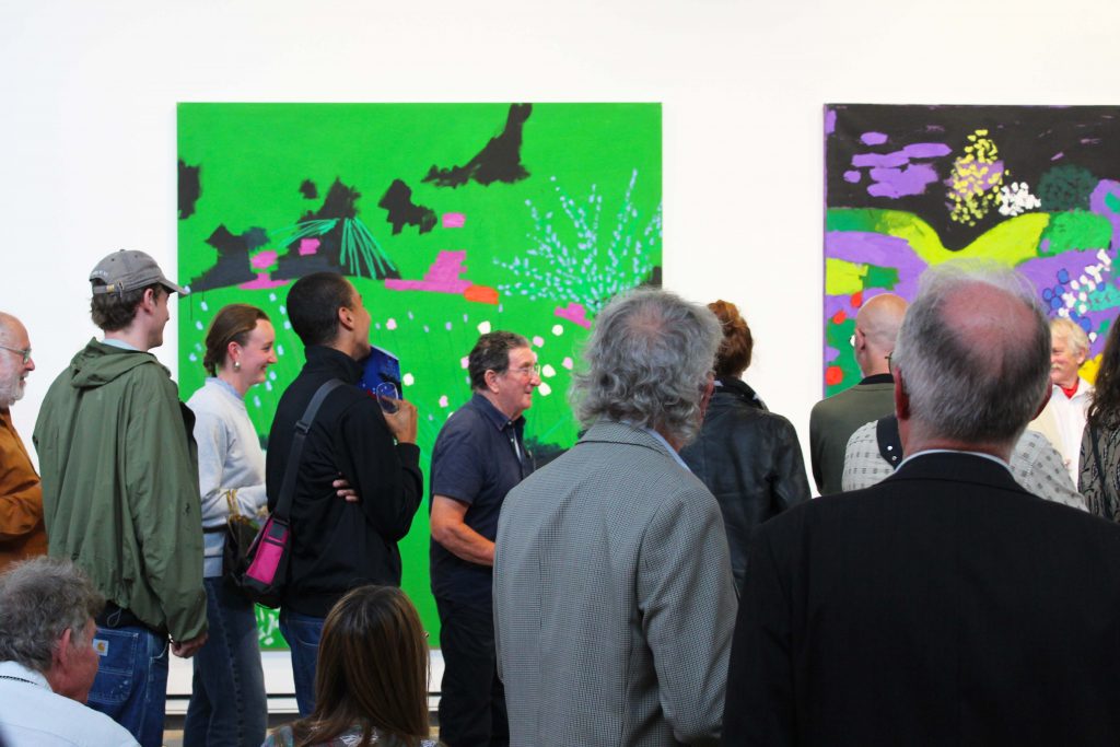 Image of people in front of McLean's Black Garden Paintings