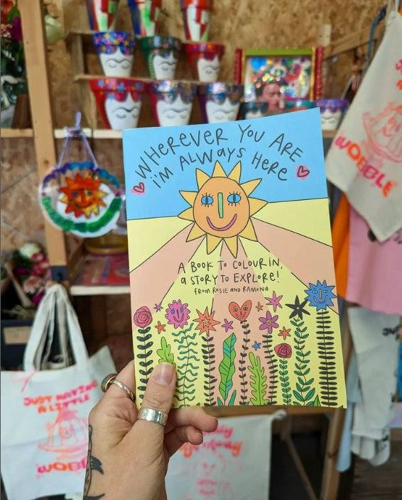 A colouring book and a quote which reads: 'Wherever you are, I'm always here' 