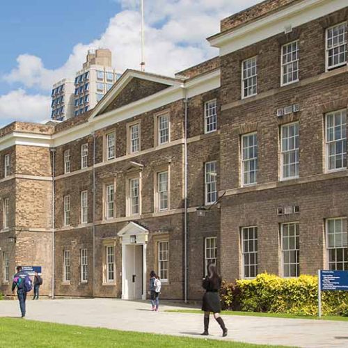 The Fielding Johnson building on the University of Leicester campus on a sunny day.