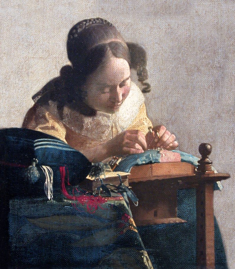 An oil painting of a women in historical costuming bending over a piece of textile she is working on.