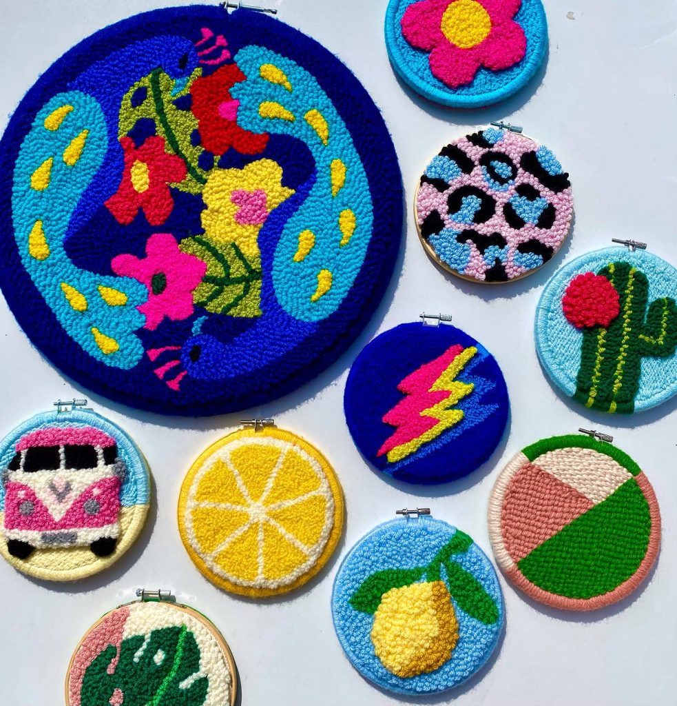 A collection of colourful and bright punch needle works in hoops.