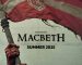 Bloodied hands holding up a red and white flag with a crest in the middle. Below is says 'Shakespeare's Macbeth Summer 2025'.