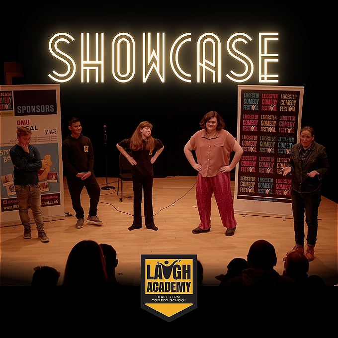 Five people on a stage in front of a crowd with the word 'Showcase' above them.