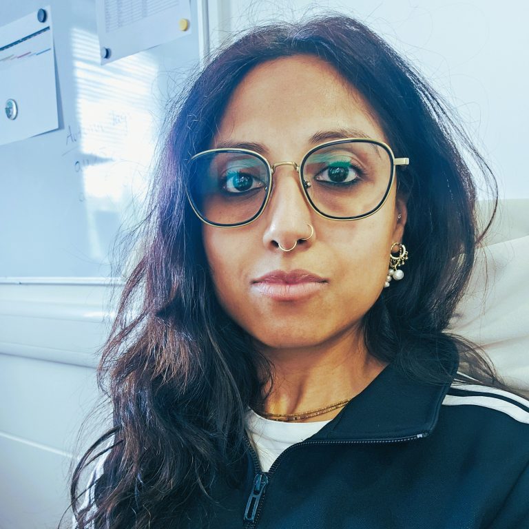 A portrait of a person wearing glasses