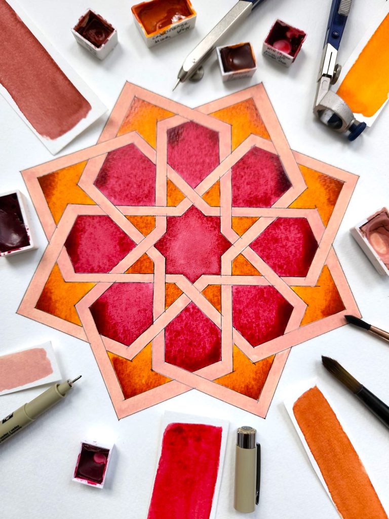 Islamic geometric water coloured pattern in red tones.