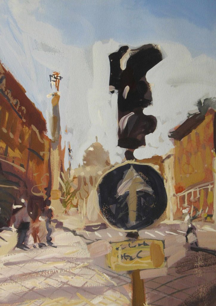 A stylistic painting on a stop sign in the middle of a town.